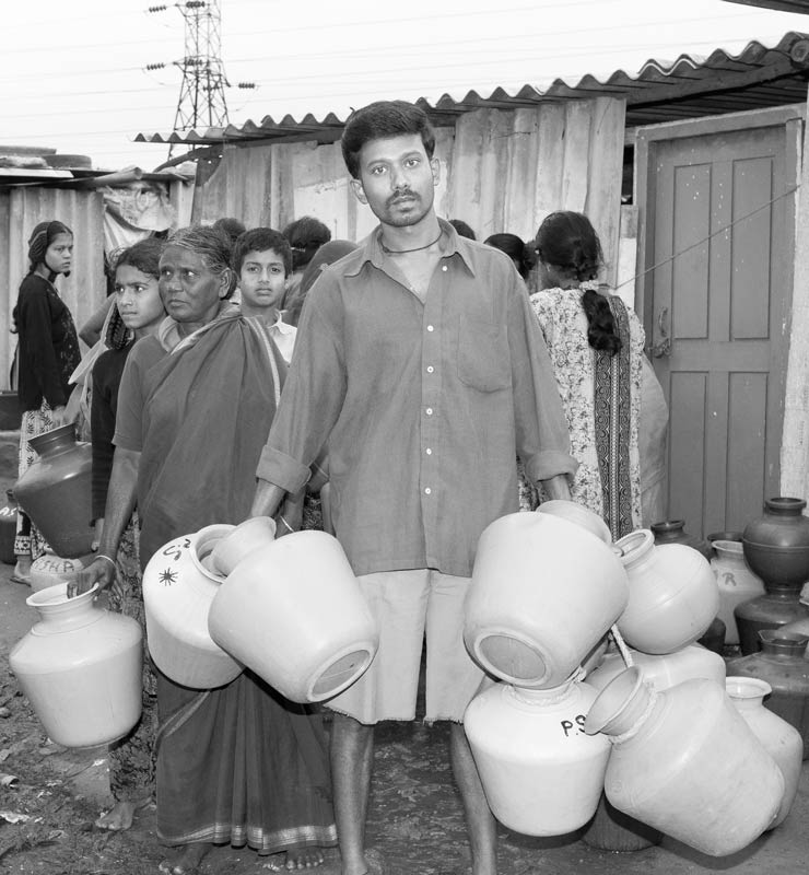 Water portraits - Queuing up for water at the community borewell – Bengaluru city, Karnataka